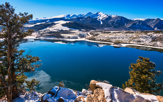 colorado lake with snowcapped mountain