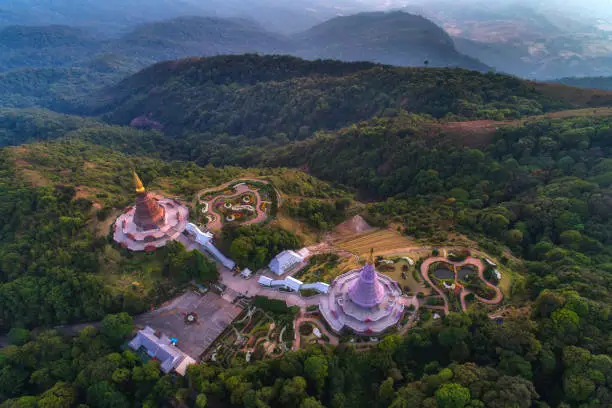 Photo of Aerial view (drone shot) of sunrise scence of two pagoda on the top of Inthanon mountain in doi Inthanon national park, Chiang Mai, Thailand