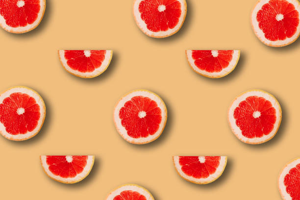 istock summer pattern with red juicy ripe fresh grapefruit on a yellow background 1294381870