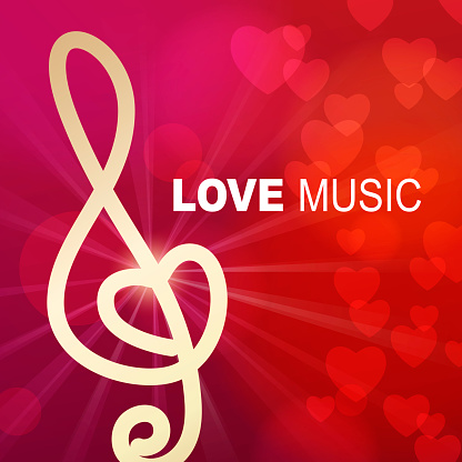 Gold colored treble clef for the Romantic love songs and music shining on the light beam heart background