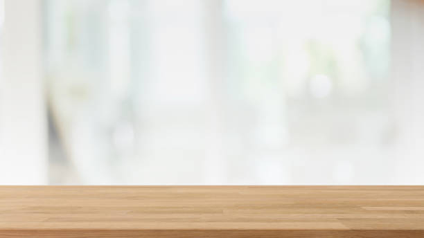 istock Empty wood table top and blur glass window interior restaurant and cafe banner mock up background - can used for display or montage your products. 1294384175