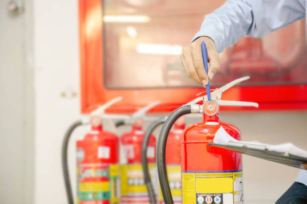 istock Engineer inspection Fire extinguisher and fire hose. 1294385327