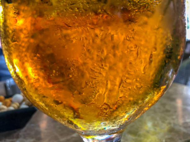 istock Pouring beer with bubble froth in glass 1294387601