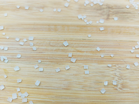 sugar crystals on wooden board