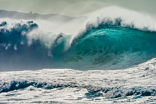 Late afternoon big waves and barrels breaking on the North Shore of Oahu, Hawaii at Backdoor.