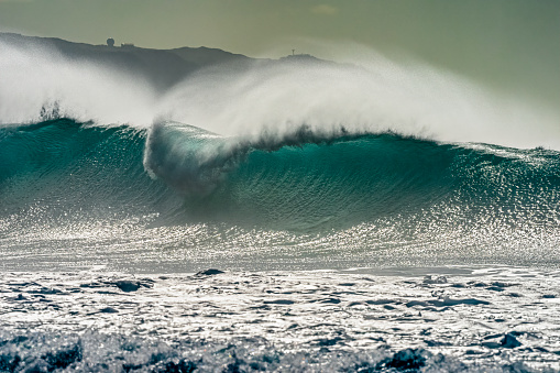 Breaking waves surrounding the Hawaiian Island of Oahu