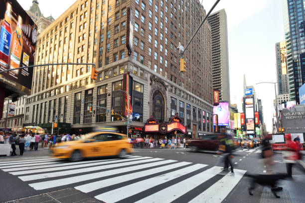 New York, USA - June 04, 2013: Men and women are crossing Canal Street at chinatown in New York.