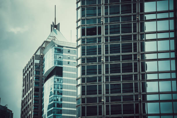 Skyscrapers on bright sun and clear blue sky background