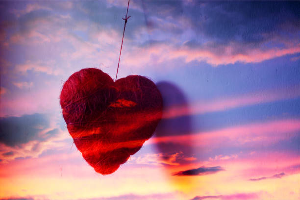 istock 3d,a heart hanging from the sky 1294391099