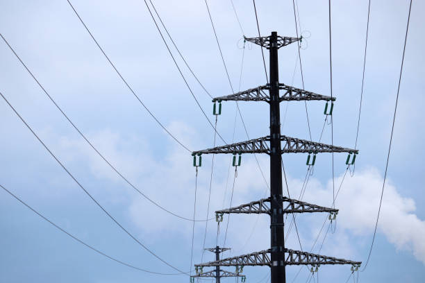 istock High voltage tower with electrical wires on blue sky background 1294392198