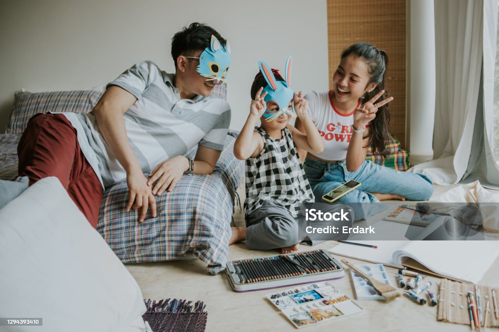 I love rabbit, little cute said with her father and sister while playing game together-stock photo Moment, happiness, imagination, inspiration, togetherness, smiling, indoor, Thailand Rabbit - Animal Stock Photo