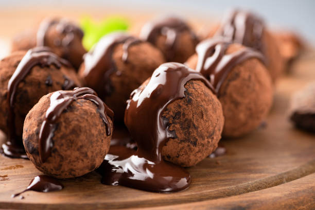 istock Sweet chocolate truffles with chocolate glaze 1294393553