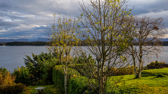 An intense sky with some rain clouds over the rocky coast and the Byfjorden fjord near the city of Stavanger in southern Norway. Image in high definition format.