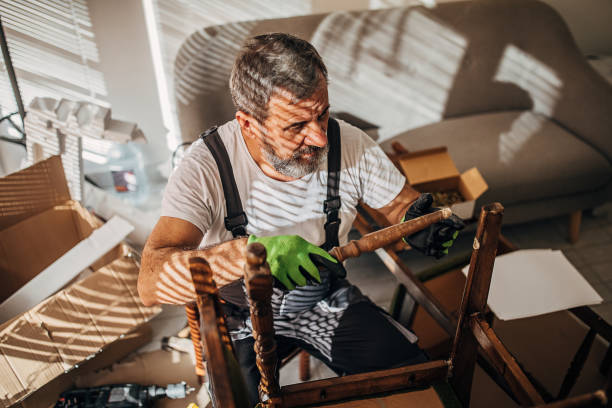 istock An old carpenter assembles furniture 1294396733