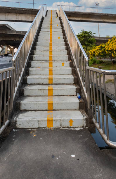 istock overpass bridge with a walking direction symbol on the step 1294398209
