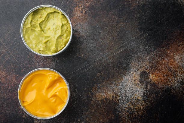 istock Canned guacamole and cheese dip, top view or flat lay with copy space for text 1294399708