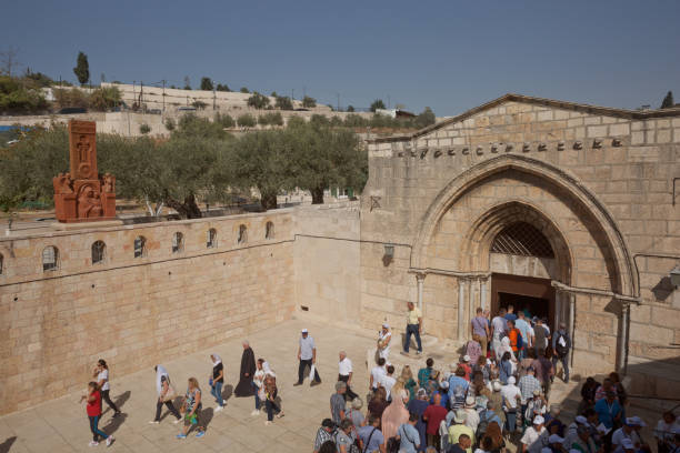 People entering Church of the Sepulchre of Saint Mary, known as Tomb of Virgin Mary, sanctuary at Mount of Olives in Kidron river valley near Jerusalem Jerusalem, Israel - October 23, 2017: People entering Church of the Sepulchre of Saint Mary, known as Tomb of Virgin Mary, sanctuary at Mount of Olives in Kidron river valley near Jerusalem. tomb of the virgin mary in jerusalem stock pictures, royalty-free photos & images