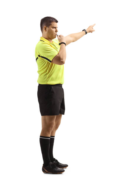 istock Side view of a football referee blowing a whistle 1294401149