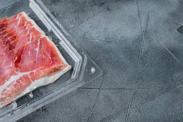 istock Delicious serrano ham jamon, on gray background  with copy space for text 1294402715