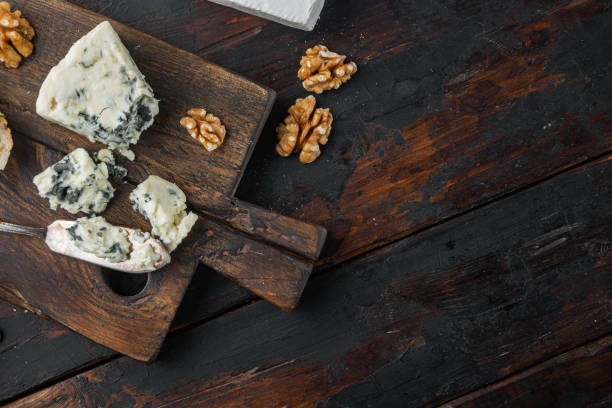 French roquefort cheese, on dark wooden background, flat lay  with copy space for text French roquefort cheese set, on dark wooden background, flat lay  with copy space for text roquefort cheese stock pictures, royalty-free photos & images