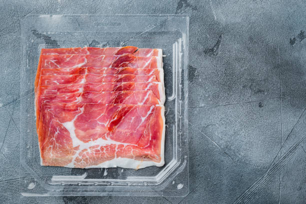 istock Parma ham, on gray background, flat lay  with copy space for text 1294404485