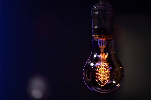 istock Close up burning lamp in the dark copy space. 1294404900