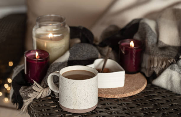 istock Cozy home composition with a cup of coffee and candles. 1294405638