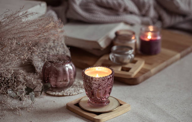 istock Composition of beautiful vintage candlesticks with burning candles on a blurred background. 1294405762