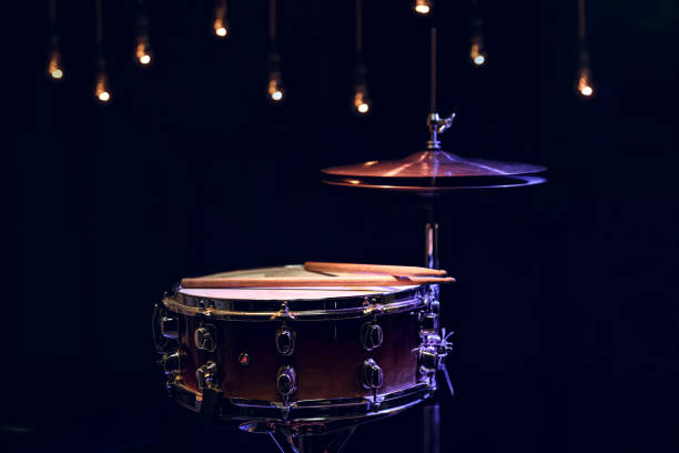 istock Snare drum and hi-hat in the dark on a blurred background with lights. 1294406125