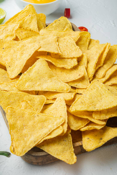 istock Nachos and guacamole and cheese sauce, on white background 1294407415
