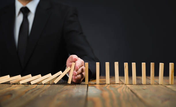 istock Protecting Assets From Domino Effect. Stop Loss Concept. 1294408378