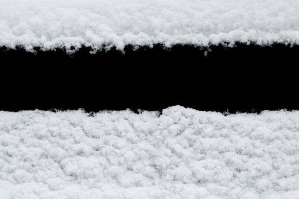 istock White snow isolated on black background 1294408791