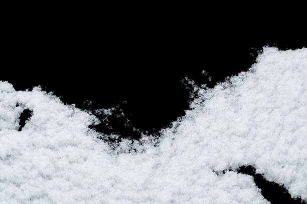 istock White snow isolated on black background 1294408805
