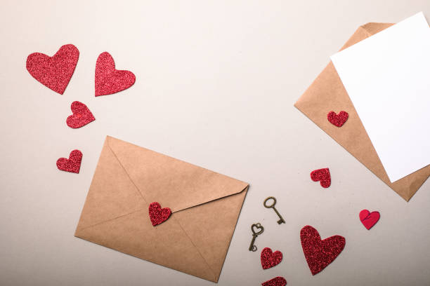 istock Paper envelope with Valentines hearts on gray background. Flat lay, top view. Romantic love letter for Valentine's day concept. 1294408907