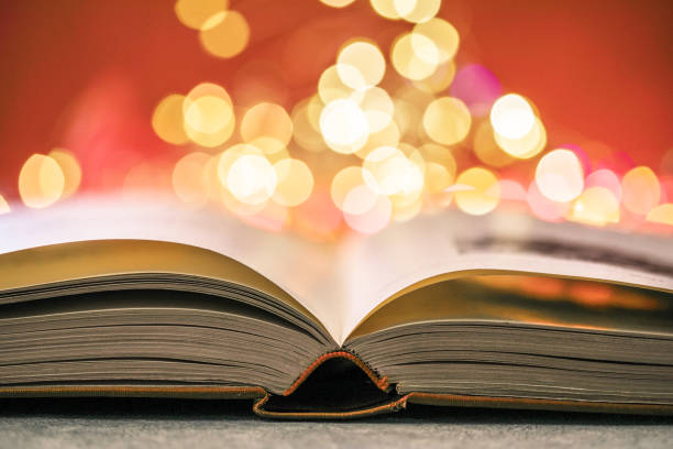 istock Book with lights on red background. Romantic Valentine  concept 1294409543
