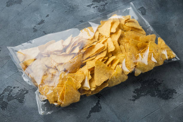 istock Nachos, triangle traditional Mexican corn appetizer, on gray background 1294409755