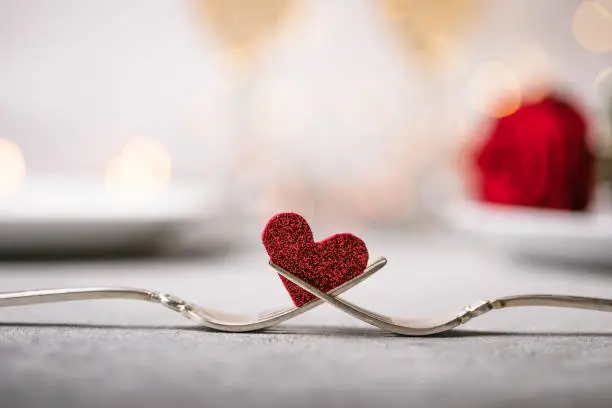 Photo of Forks and a heart. Holiday menu for Valentines Day.