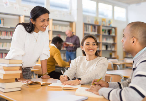 istock Adult people gaining skills at public library 1294410002