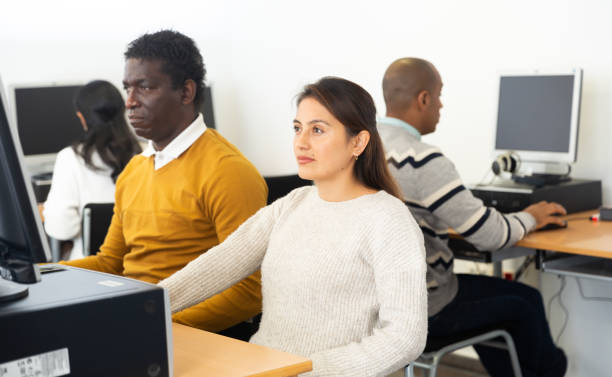 istock Young adult woman studying in computer class 1294410164