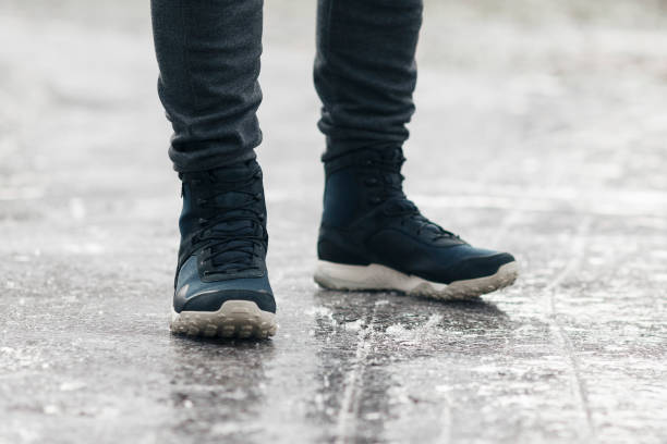 istock Dangerous icing on the sidewalk, slippery road 1294411321