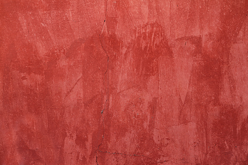 Old red painted wall background