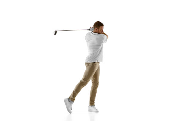 istock Golf player in a white shirt taking a swing isolated on white studio background 1294414894