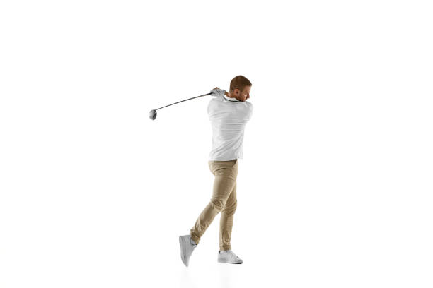 istock Golf player in a white shirt taking a swing isolated on white studio background 1294414896