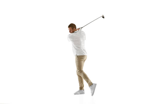 istock Golf player in a white shirt taking a swing isolated on white studio background 1294414902