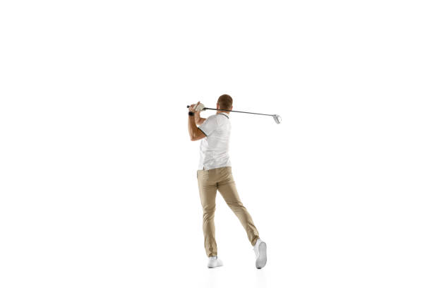 istock Golf player in a white shirt taking a swing isolated on white studio background 1294414904