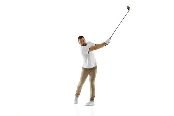 istock Golf player in a white shirt taking a swing isolated on white studio background 1294414907