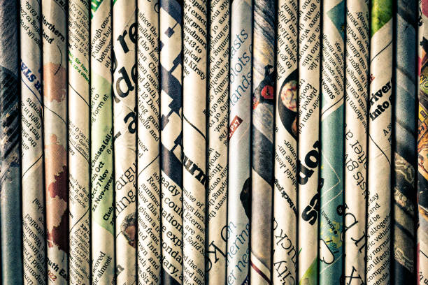 istock Rolled newspaper pages abstract background 1294416226