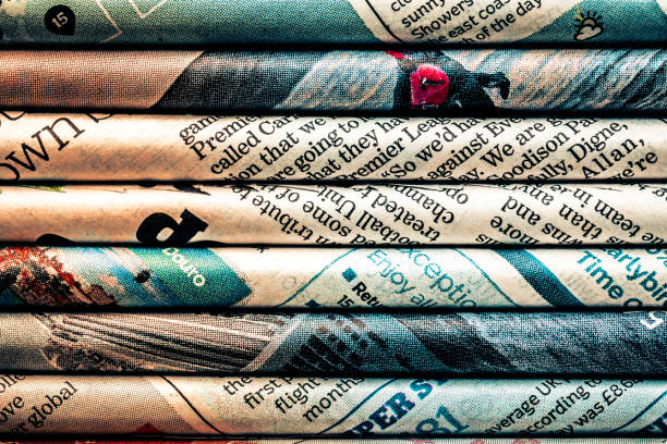 rolled newspaper pages abstract background - newspaper business close up nobody imagens e fotografias de stock