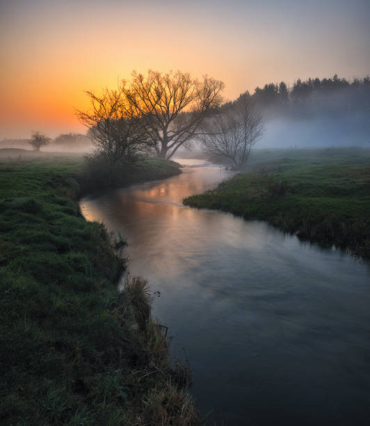 istock Beautiful spring sunrise over river banks 1294417257