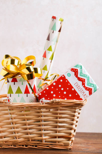 istock Wrapped Christmas gifts in a storage basket 1294418444
